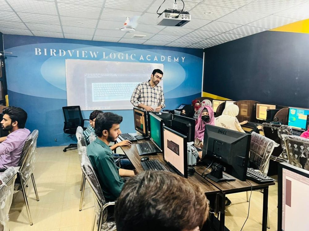 BvLogic Academy computer lab in Faisalabad with students and projector