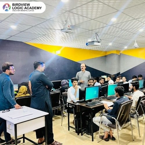 Students learning on computers at BvLogic Academy